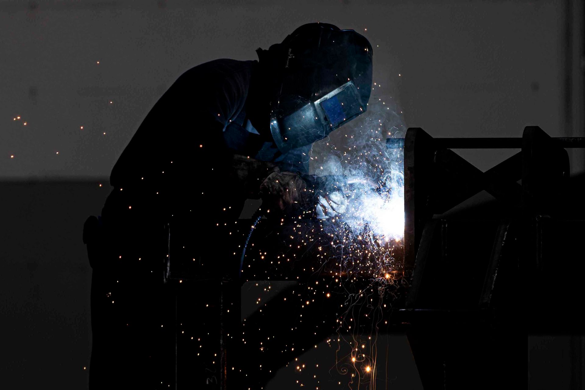 Welder building an APEX Hyperdisc frame in the factory