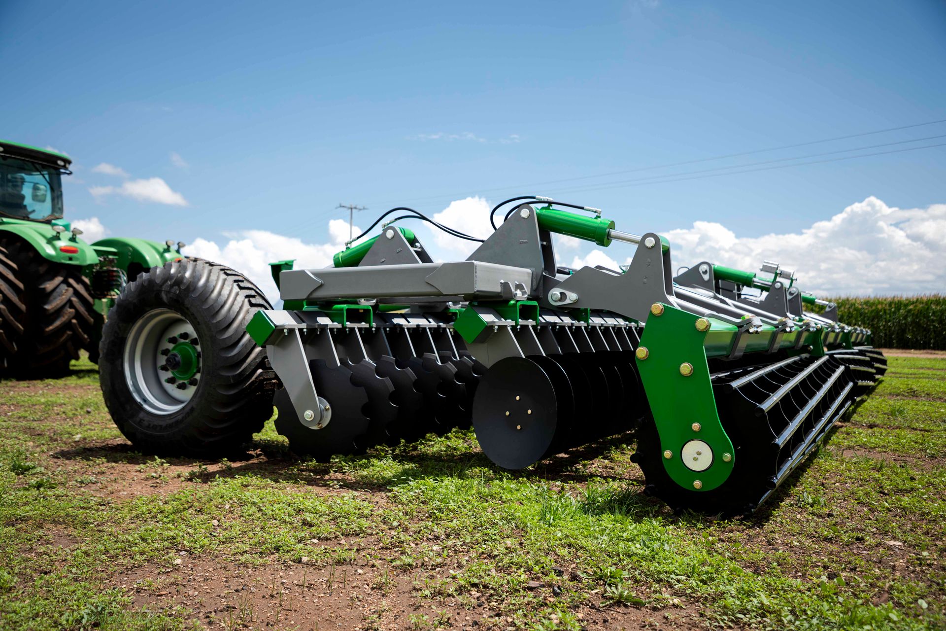 APEX Hyperdisc T Series T38 with a John Deere tractor, three-quarter view